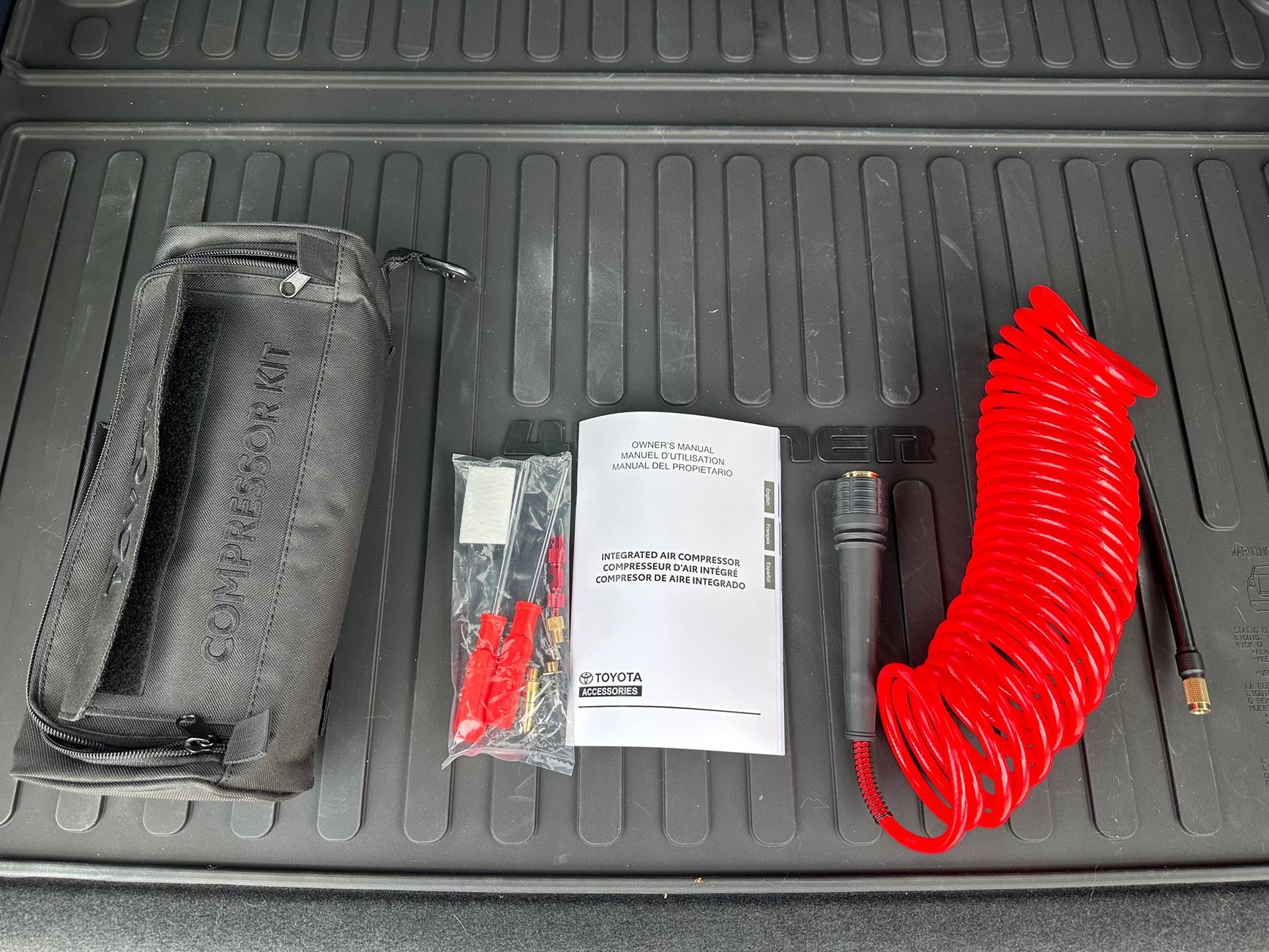 2025 4runner 6th gen Trailhunter questions: compressor air hose / chuck, Aux harness / pigtails, miles at delivery? IMG_6249