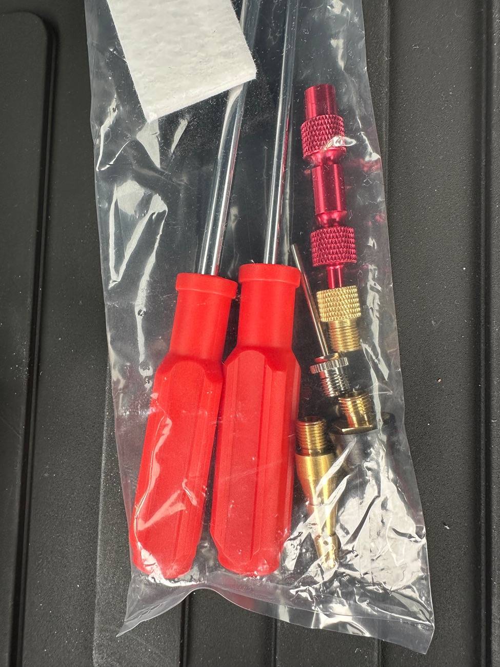 2025 4runner 6th gen Trailhunter questions: compressor air hose / chuck, Aux harness / pigtails, miles at delivery? IMG_6250