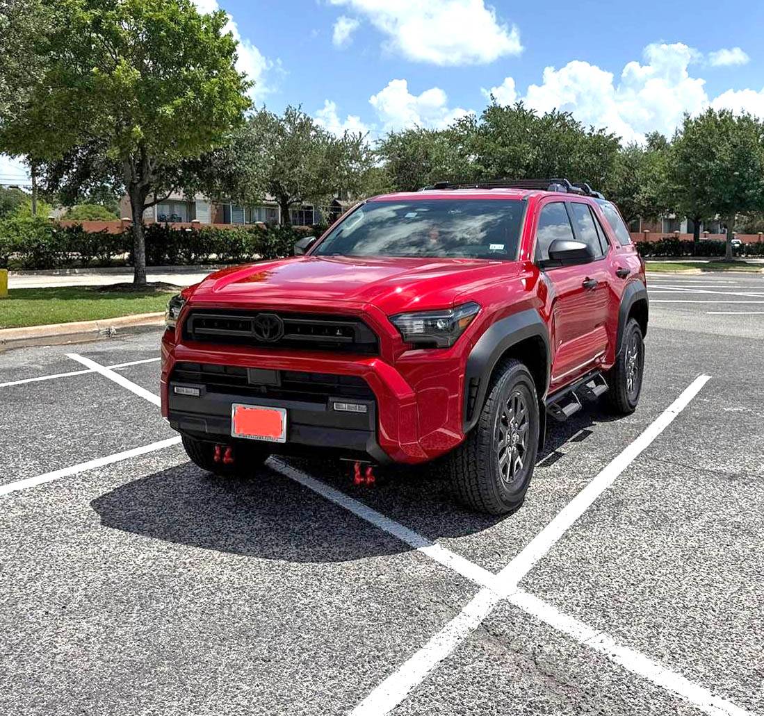 2025 4runner 6th gen First month mods: Bridgestone Dueler A/T RH-S All Terrain 255/75R17 115T, red seat covers and red shackles IMG_8704