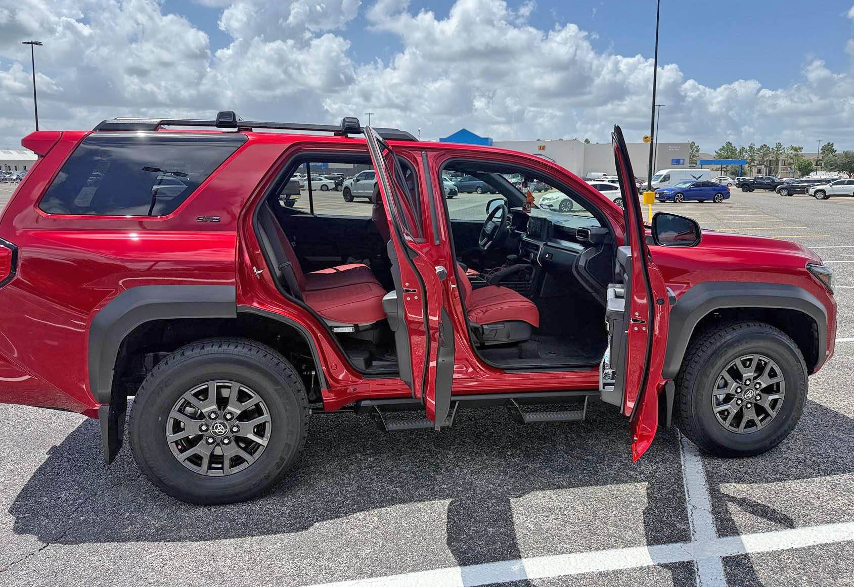 2025 4runner 6th gen First month mods: Bridgestone Dueler A/T RH-S All Terrain 255/75R17 115T, red seat covers and red shackles IMG_8706