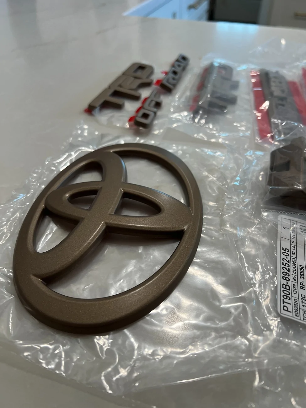 2025 4runner 6th gen WTS - Toyota OEM Bronze Emblem Overlay Kit - TRD Off Road IMG_0484