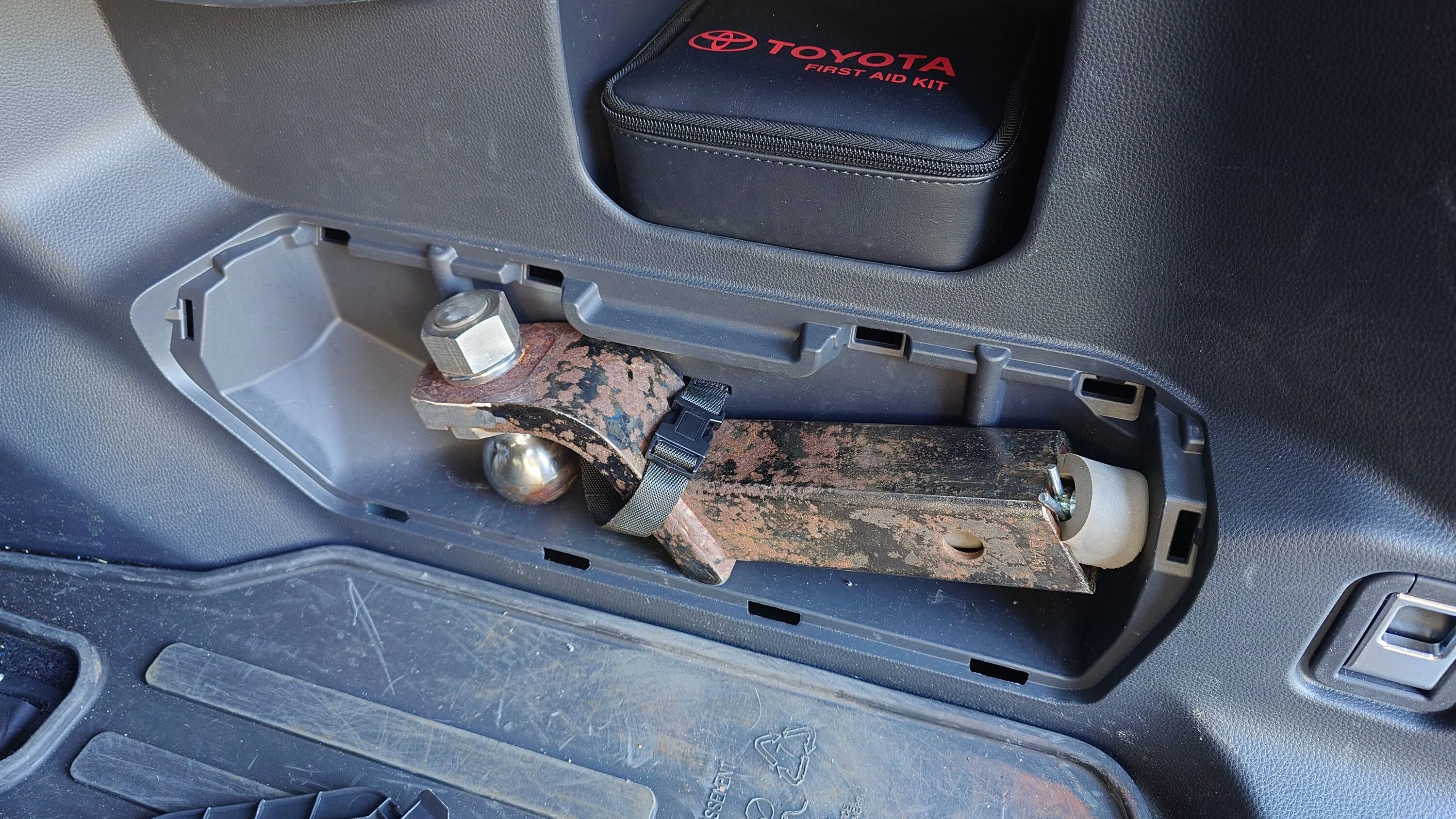 2025 4runner 6th gen Relocated the tire iron kit (under the jack) to store a hitch in the tire iron cubby 20250903_164334242
