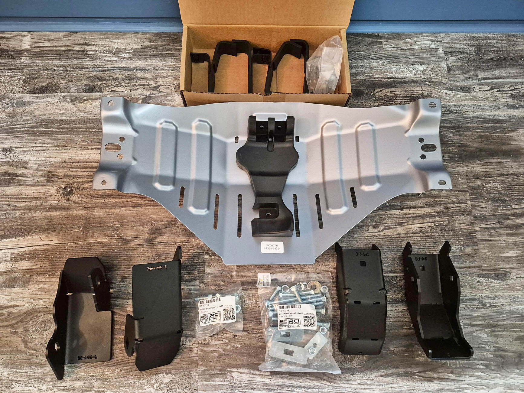 2025 4runner 6th gen OEM differential skid plate, RCI Front and Rear lower control link skids, LCA skids and rear shock skids installed OEM differential skid plate and REI (Rear) Front and Rear lower control link skids 1