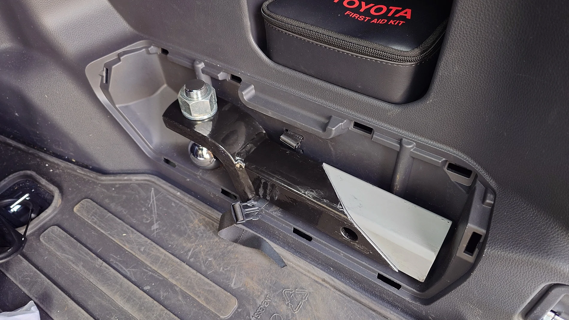 2025 4runner 6th gen Relocated the tire iron kit (under the jack) to store a hitch in the tire iron cubby 20250909_084548918