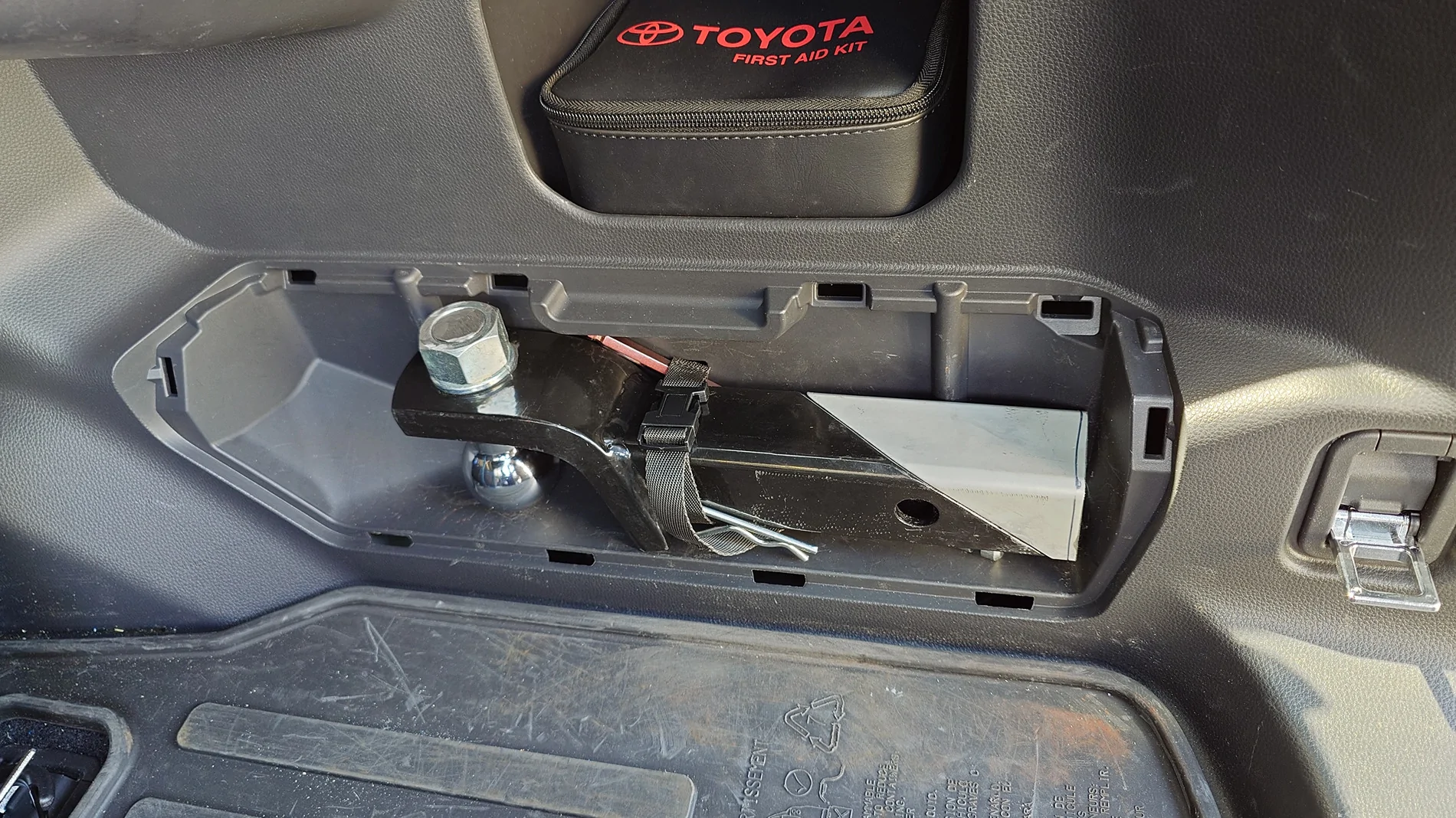 2025 4runner 6th gen Relocated the tire iron kit (under the jack) to store a hitch in the tire iron cubby 20250909_141044591
