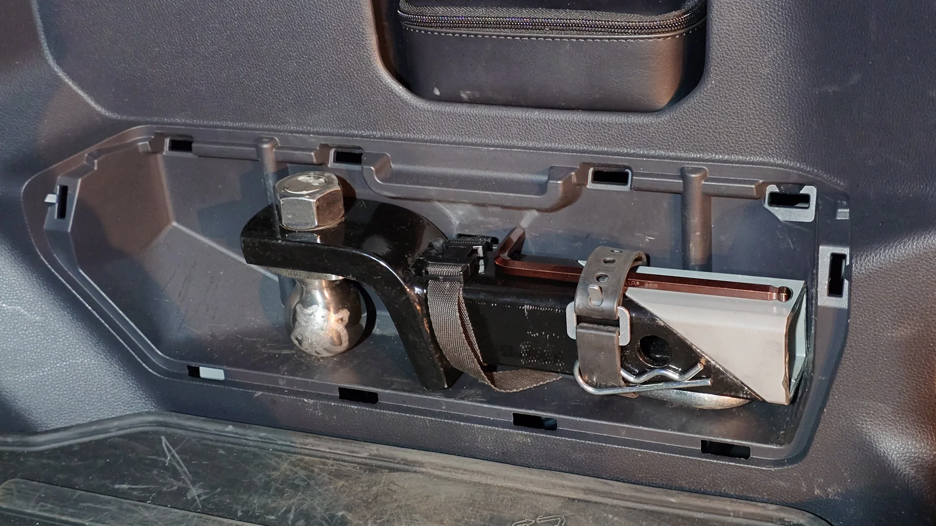 2025 4runner 6th gen Relocated the tire iron kit (under the jack) to store a hitch in the tire iron cubby 20250910_194017050