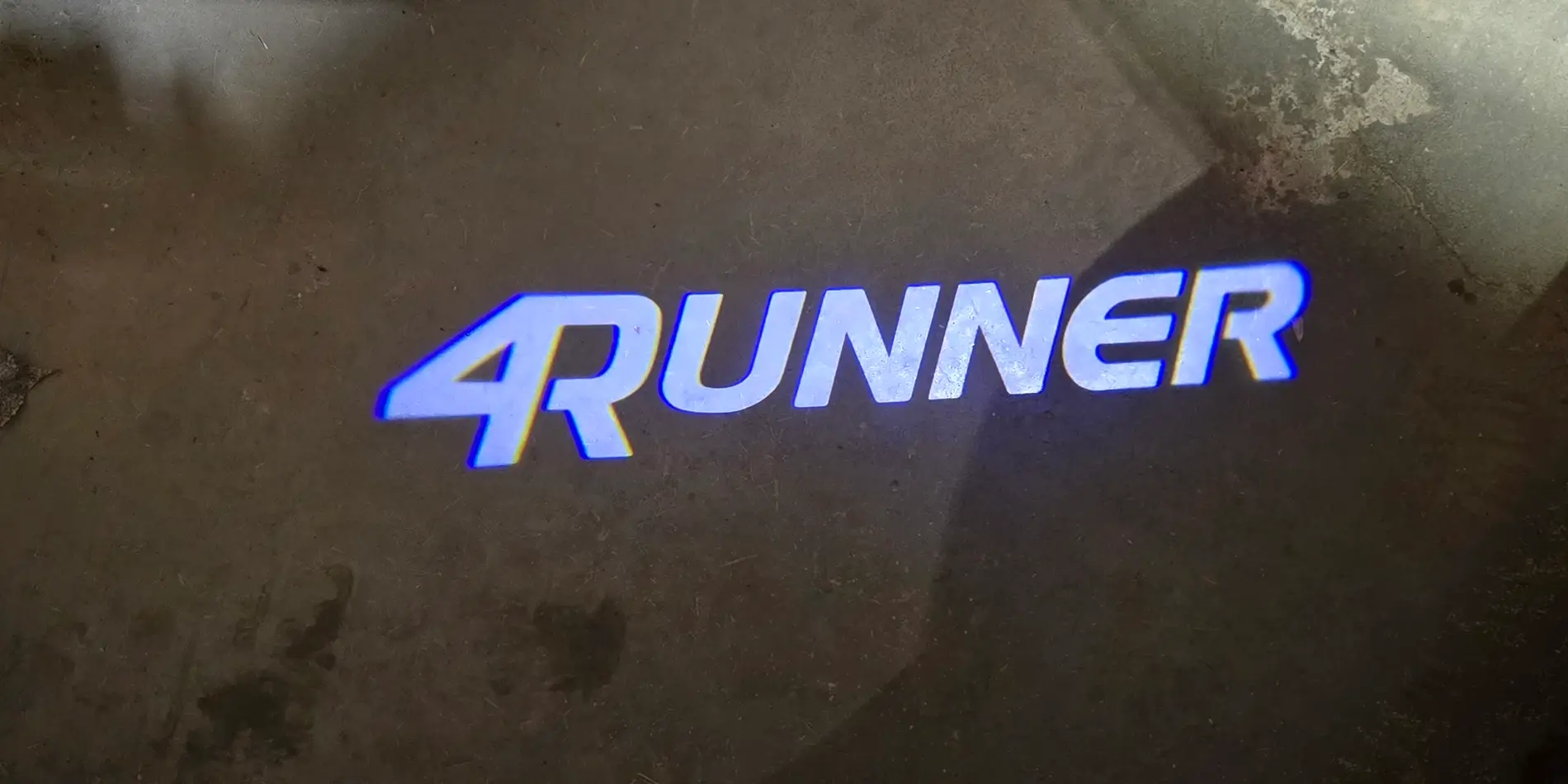 2025 4runner 6th gen Puddle lights installed (Trailhunter projection light) 2025 4Runner Front Door Puddle Lights Dark Resized