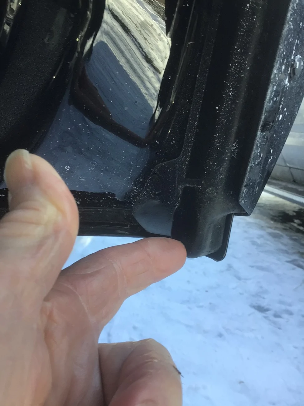 2025 4runner 6th gen Gap below rear door letting snow/mud inside — normal design or missing plug? IMG_2703