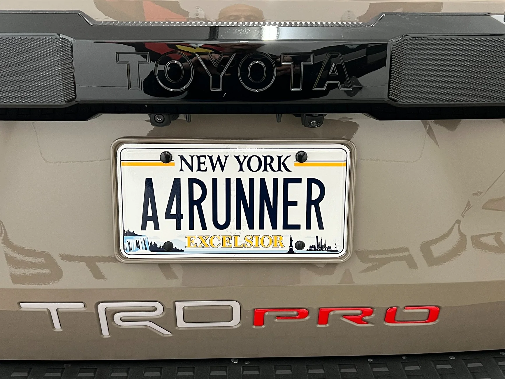 2025 4runner 6th gen Color matched (painted) license plate frame to Mudbath color IMG_1613