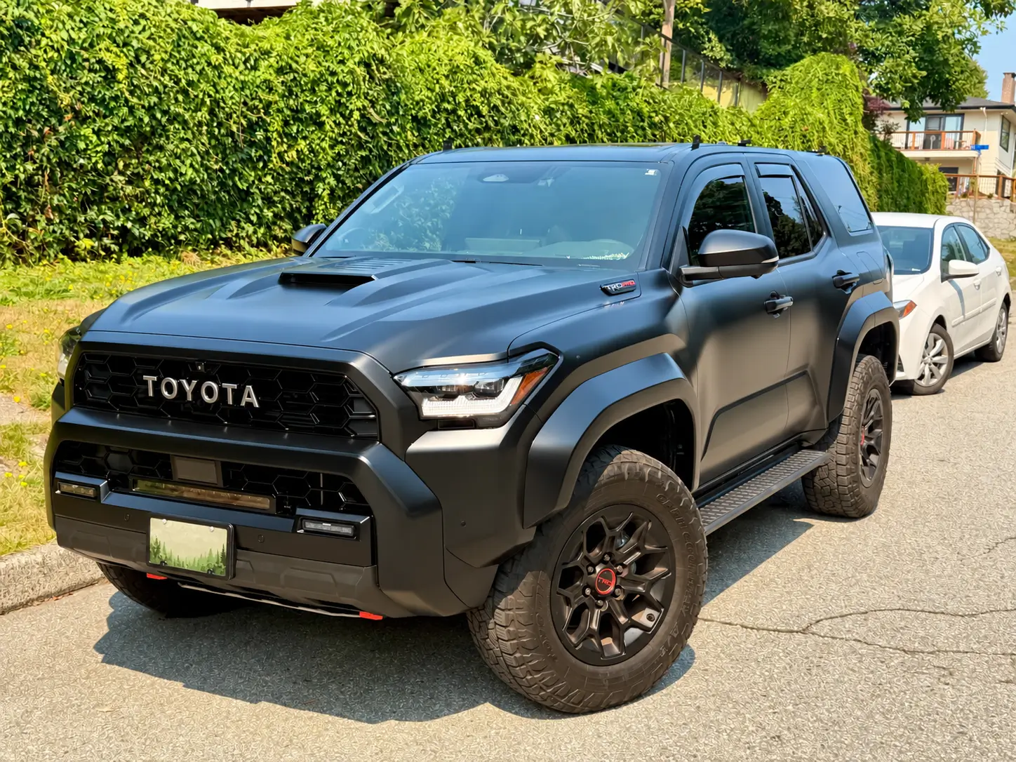 2025 2026 4runner 6th gen From 2025 Limited to 2026 TRD Pro - my experience Matte Black Toyota 4Runner on a Sunny Residential Street (1)