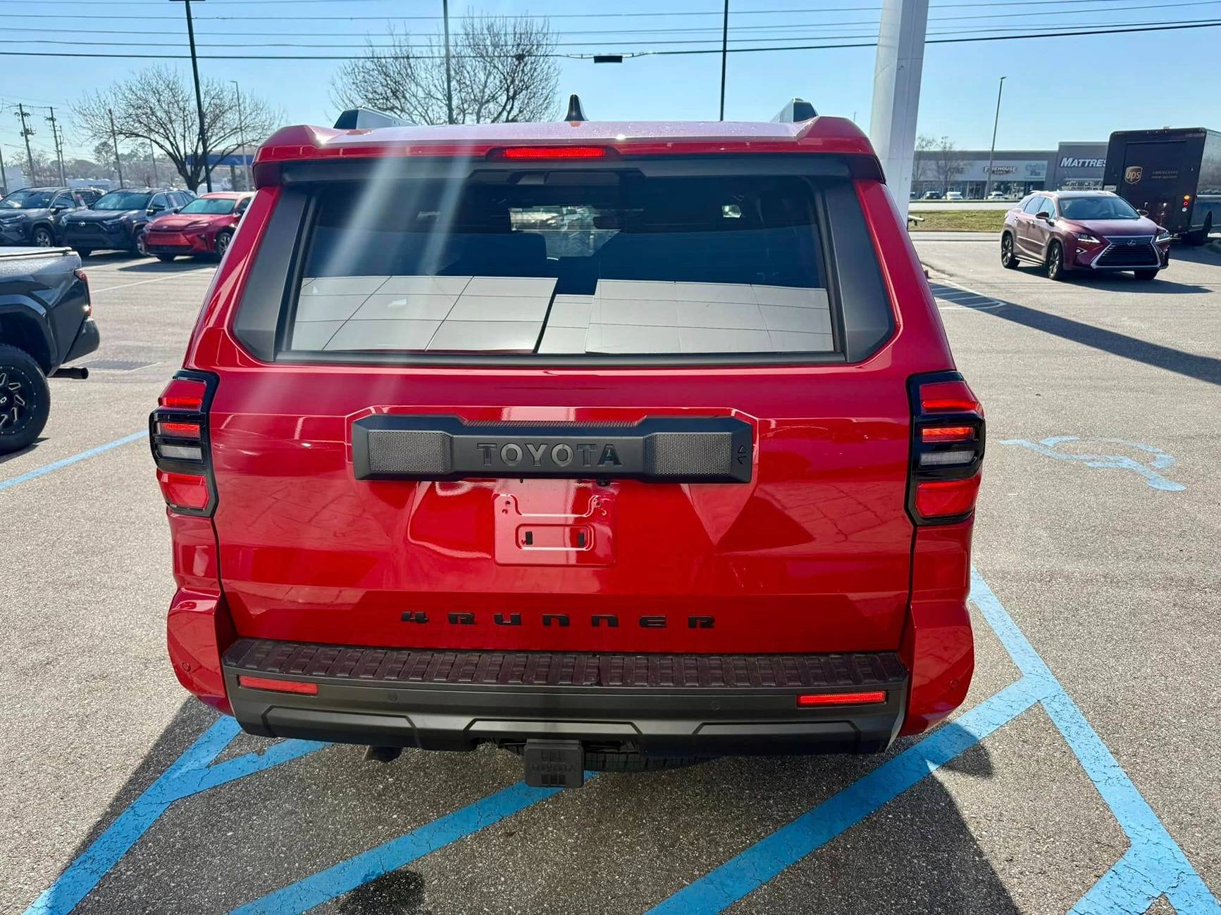 2025 4runner 6th gen Supersonic Red pops in the sun -- TRD Off-Road Premium w/ Black Softex Seats Supersonic Red TRD Off-Road PREMIUM 2025 4runner 6th gen exterior color 3