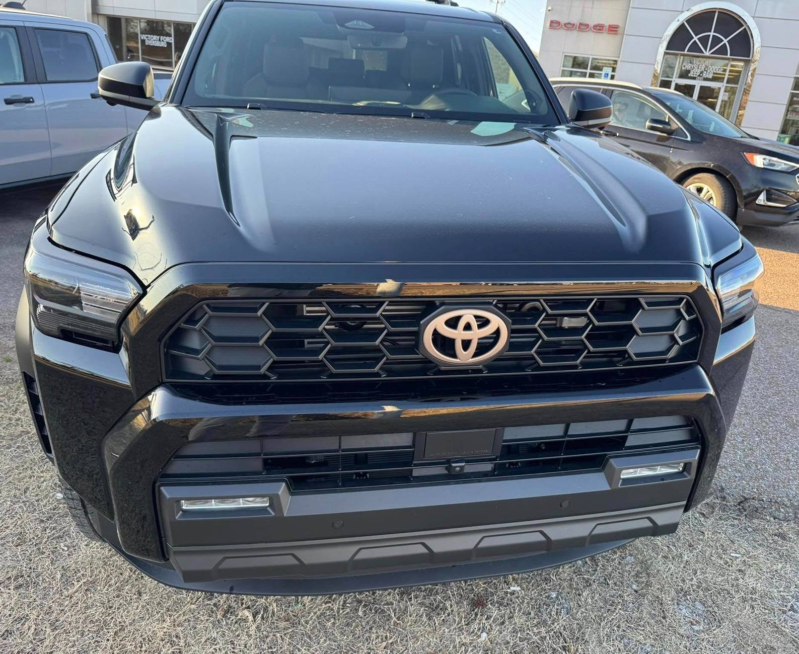2025 4runner 6th gen BLACK Photos 4Runner 6th Gen (2025+) Bronze badge overlays on black 2025 4runner off-road  3