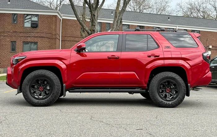 TRD Sport on TRD Pro wheels + 265/70/18 Goodyear Territory R/T tires (stock suspension Supersonic Red)