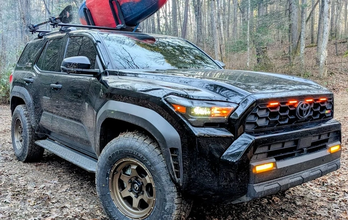 Bronze Fuel Shok +20mm offset wheels & Toyo AT3 285/70/17 SL tires on Black ORP